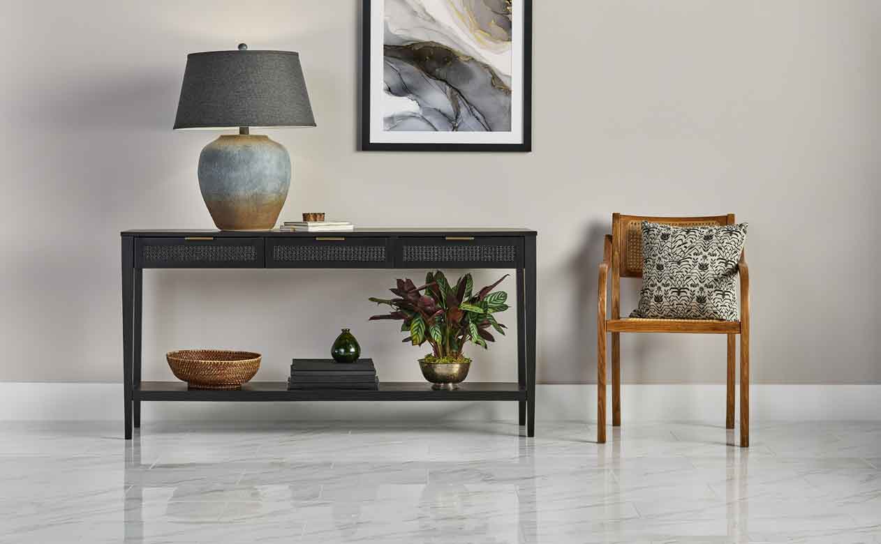 Living room in Rockville Centre with Woven Drawer Console Table Black and marble look tile flooring